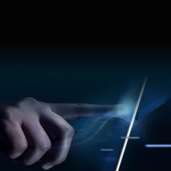 Hand interacting with futuristic digital interface using touch and light trail effect